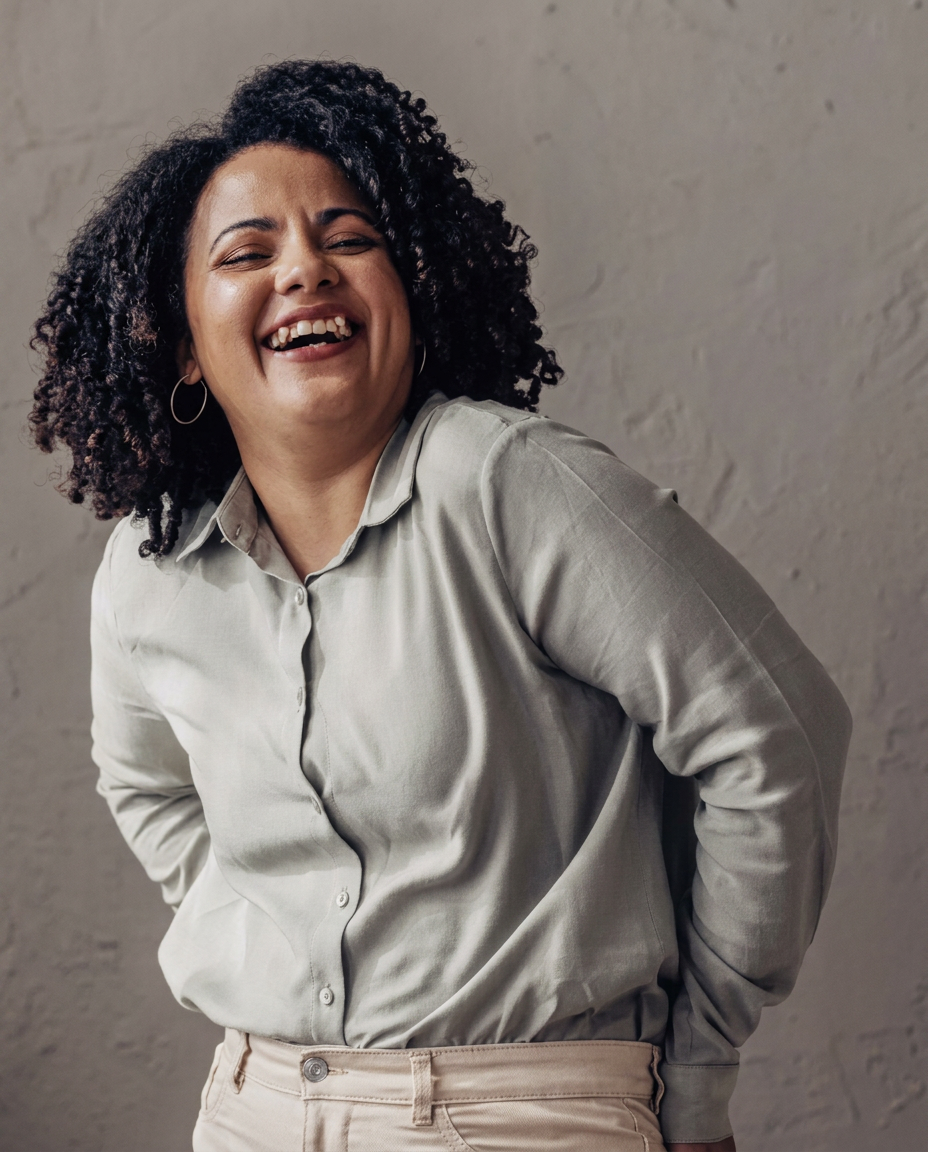 Wellora member laughing warmly — free exercise-for-weight-loss guide